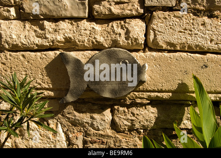 Croatia; Hrvartska; Kroatien; Šibenik-Knin, Privč Island, Privč Luka, wooden fish decoration on stone wall of house Stock Photo