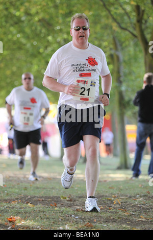 Runner in the fun run for Hertfordshire Air Ambulance at Fairlands Valley Park Stevenage 27th September 2009 Stock Photo