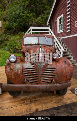 Rusting old dodge car on the dock in northwest Canada. Stock Photo