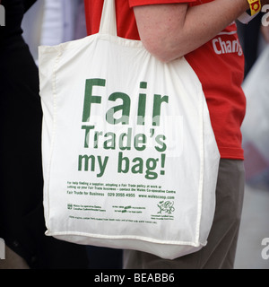 Woman with a Fair Trade canvas bag at the Abergavenny food festival, Monmouthshire south wales UK. Stock Photo