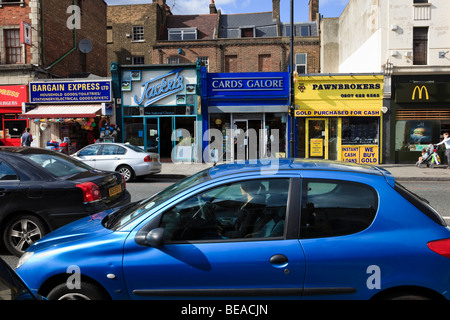 Traffic and Shops in Clapham High Street, London, UK Stock Photo