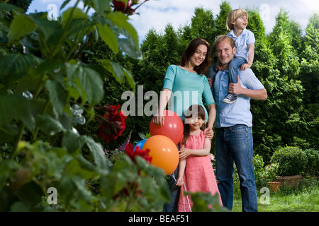 Portrait of a mid adult couple and their two small children Stock Photo