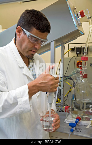 A scientist taking samples with a pipette, Cologne, Germany Stock Photo