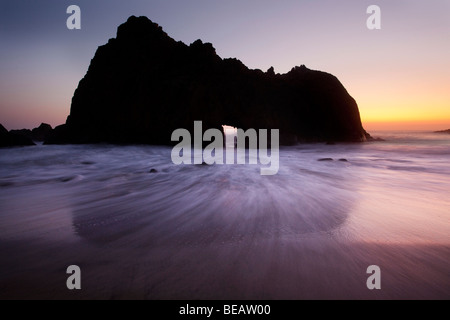 Arch of Pfeiffer beach at sunset, Big Sur, California, USA Stock Photo