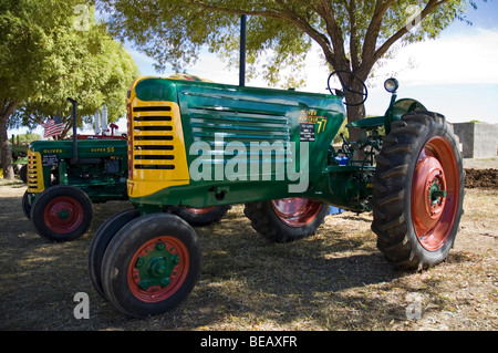 An antique 1951 Oliver Model 77 tractor on a farm. Stock Photo