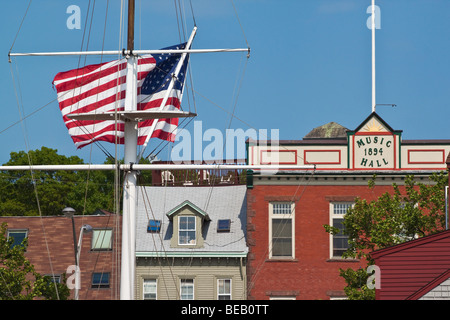 Stars and Stripes flag & the Old Music Hall on Thames Street by the historic waterfront of Newport Rhode Island New England USA Stock Photo