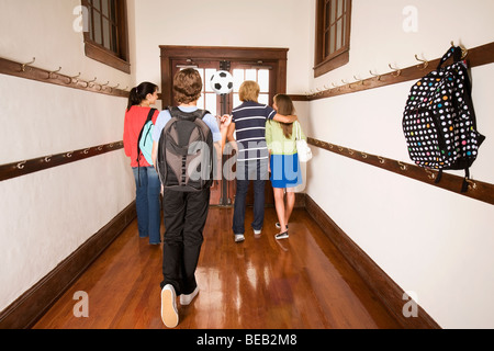 School children walking in the school corridor Stock Photo