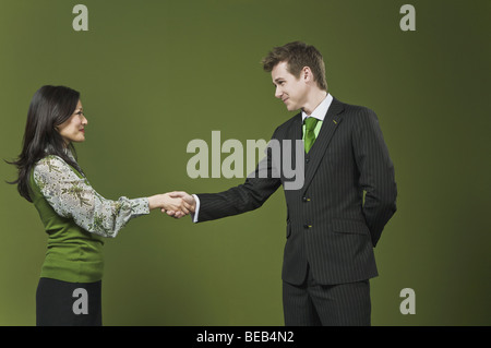 Business executives shaking hands Stock Photo