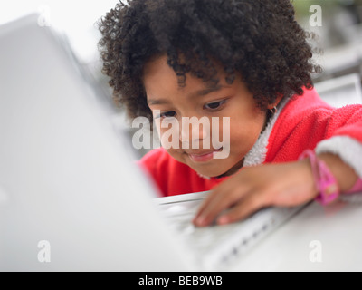 Close-up of a girl using a laptop Stock Photo