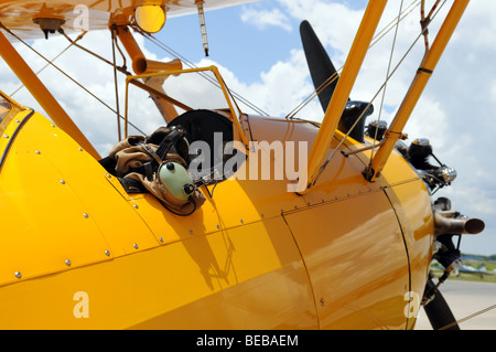 Vintage airplane detail showing cockpit and pilot gear Stock Photo