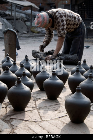 Local potters working in Pottery Square, Bhaktapur, Nepal Stock Photo