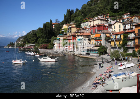 People sunbathing on the beach at Varenna on Lake Como, Italy, Europe Stock Photo