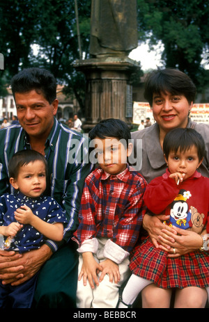 Mexicans, Mexican people, Mexican family, mother, father, children, tourists, Plaza Vasco de Quiroga, town of Patzcuaro, Michoacan State, Mexico Stock Photo