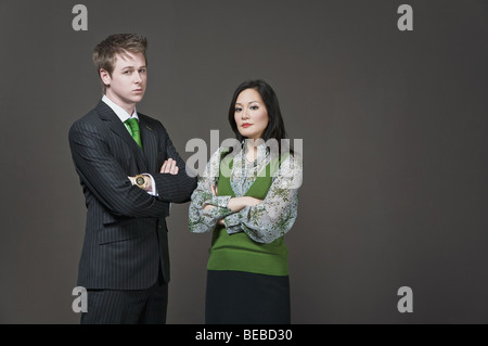 Portrait of a businessman and a businesswoman standing together Stock Photo