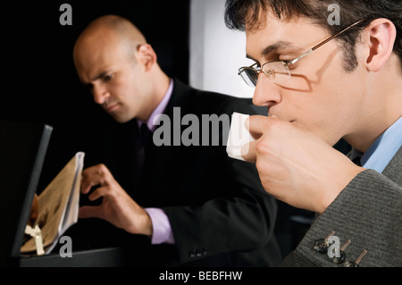 Businessman drinking tea Stock Photo