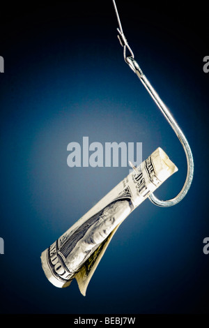 Close-up of a dollar bill hanging from a fishing hook Stock Photo