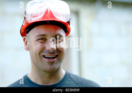 Portrait of a builder with hard hat Stock Photo