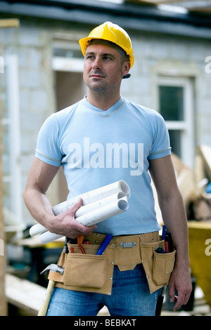 Builder with plans Stock Photo