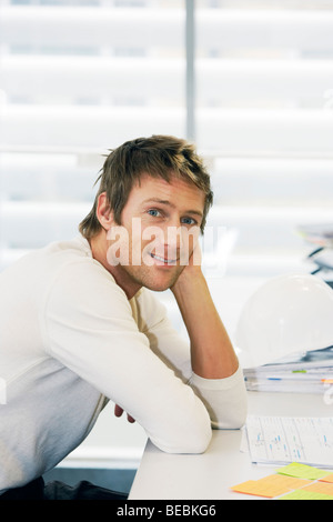 Young happy executive in office Stock Photo