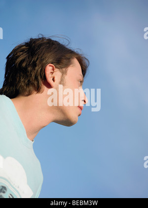 Low angle view of a young man looking up Stock Photo