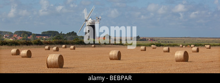 Burnham Windmill Norfolk & straw bales after harvest in late summer Stock Photo