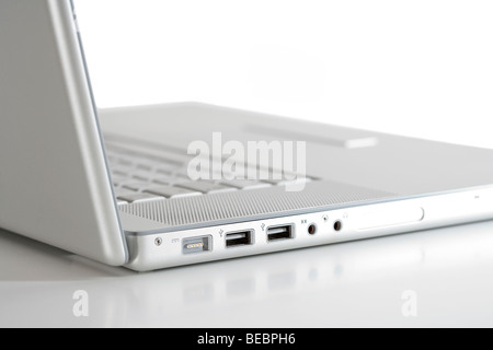open thin silver laptop computer on white - side view Stock Photo