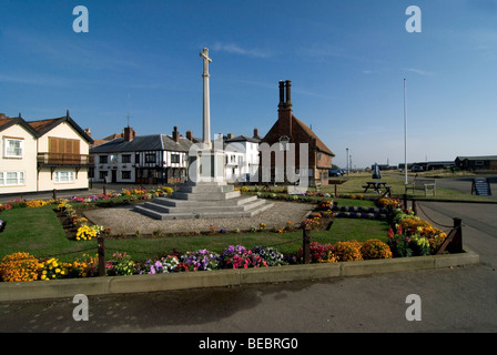 Market Cross surrounded by flowers at the seaside town of Aldeburgh, with the Moot Hall behind on a beautiful day