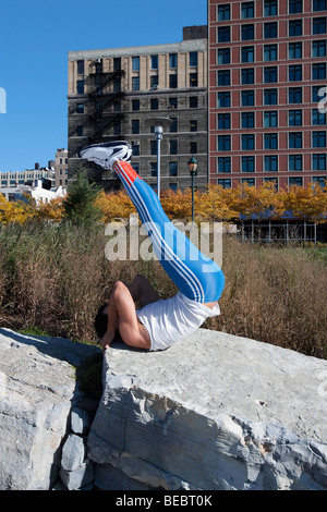 Man exercising on a stone Stock Photo