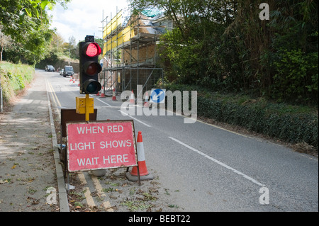 Red light showing at temporary traffic signals. Stock Photo