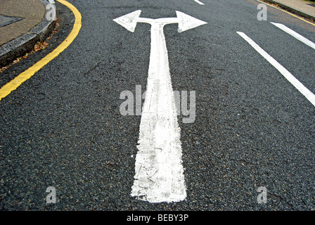 british double arrow head road marking indicating traffic can turn left or right Stock Photo