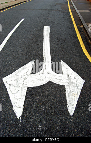 british double arrow head road marking indicating traffic can turn left or right Stock Photo