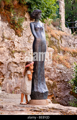 Wedding Flower Girl plays 'hard to get' with young ring bearer - wedding in Eze, Provence, France Stock Photo