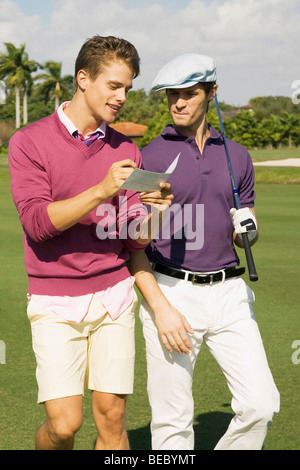 Two friends discussing in a golf course, Biltmore Golf Course, Coral Gables, Florida, USA Stock Photo