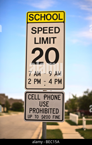 School Zone Sign with cell phone warning sign attached. Stock Photo