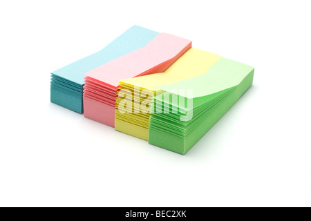 stacks of colorful narrow sticky packs on white Stock Photo