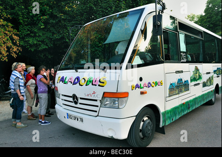 Paris, France - Group Tourists Visiting French Monument,  Local Tour Bus, Baladobus, Stock Photo