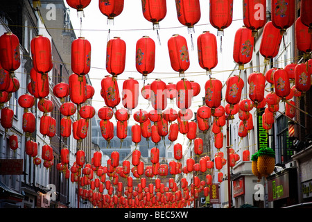 Red lanterns to celebrate Chinese New Year hang across soho in London England UK Stock Photo