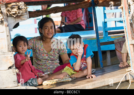 A family on a houseboat on Tong Le Sap Lake in Cambodia Stock Photo