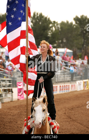 Cowgirls perform at the 84th Annual Tucson Rodeo, also know as Fiesta De Los Vaqueros, in Tucson, Arizona, USA. Stock Photo