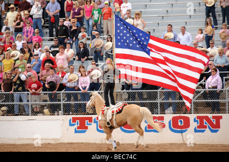 Cowgirls perform at the 84th Annual Tucson Rodeo, also know as Fiesta De Los Vaqueros, in Tucson, Arizona, USA. Stock Photo