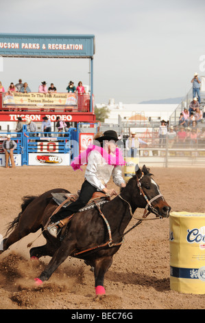 Cowgirls perform at the 84th Annual Tucson Rodeo, also know as Fiesta De Los Vaqueros, in Tucson, Arizona, USA. Stock Photo