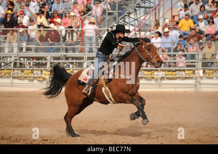 Cowgirls perform at the 84th Annual Tucson Rodeo, also know as Fiesta De Los Vaqueros, in Tucson, Arizona, USA. Stock Photo