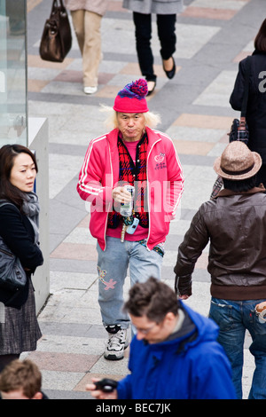 Old man in young clothes in Harajuku, Tokyo, Japan Stock Photo