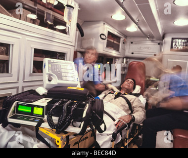 paramedics transport patient in ambulance Stock Photo