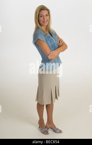 Tall lanky blonde woman posing on white background Stock Photo