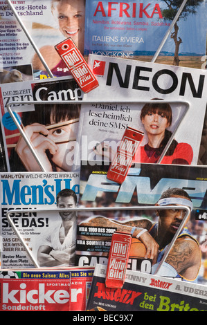 Magazine rack with current German magazines and journals Stock Photo
