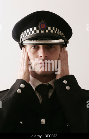 British Policeman on plain background Stock Photo