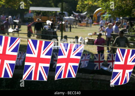 Union jack flag bunting at a village fete in Aldenham, Hertfordshire, England. Stock Photo