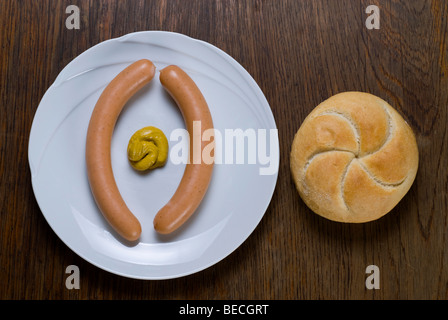 Wiener sausages with Semmel roll and medium hot mustard Stock Photo