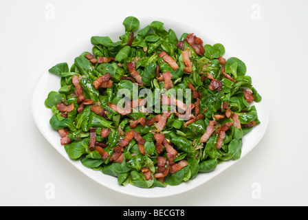Field salad (Valerianella locusta) with roasted bacon strips